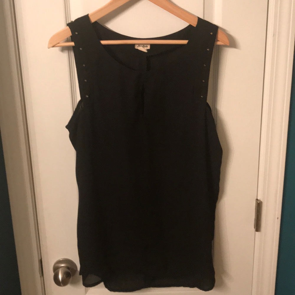 Black sleeveless blouse with gold accents